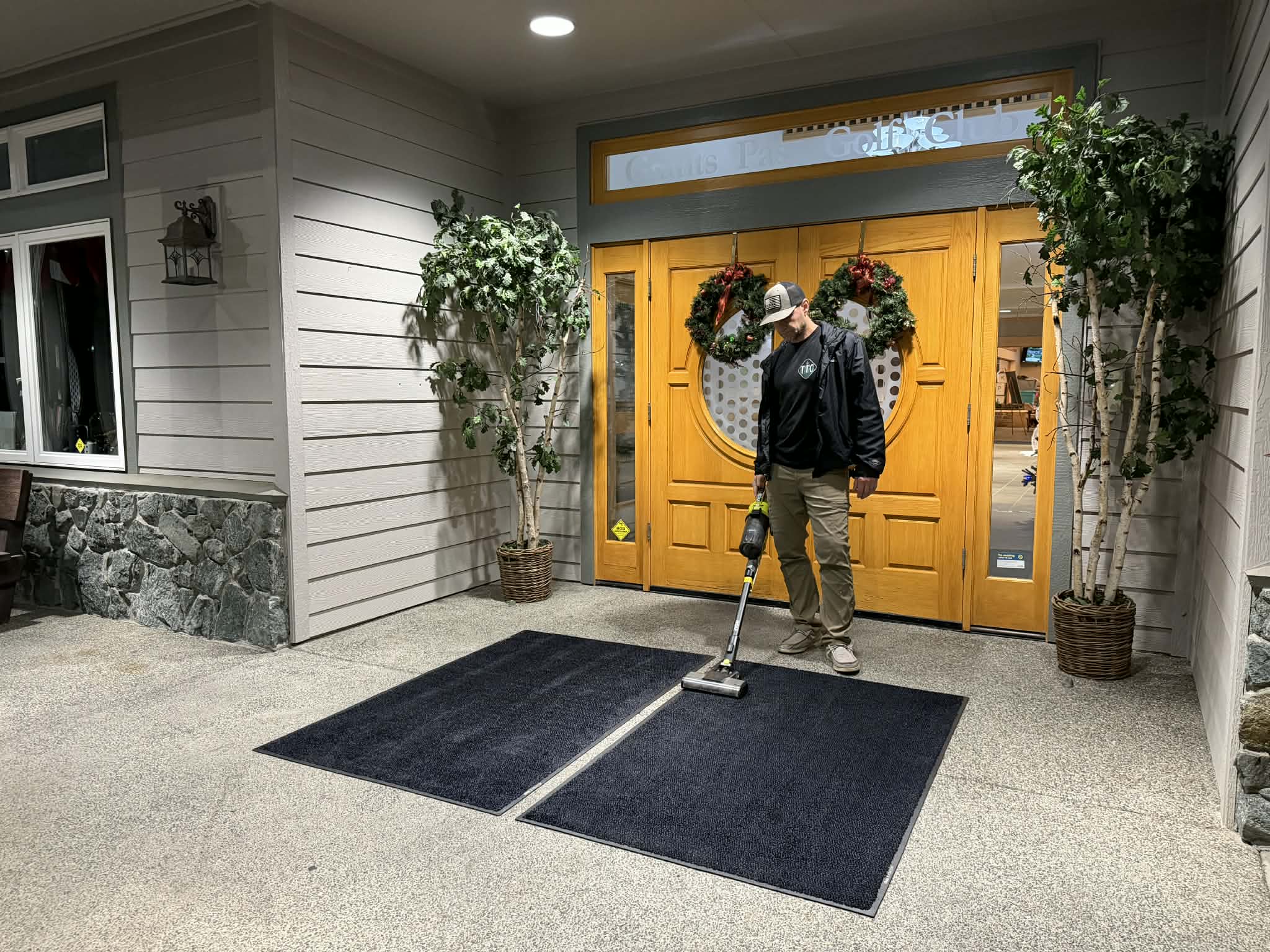 Owner cleaning mats in Rogue River, Oregon | Three Trees Cleaning